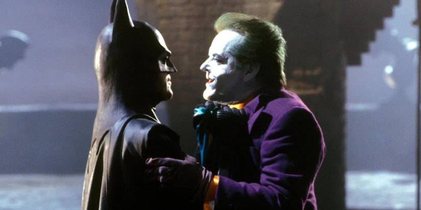 Batman (Michael Keaton) and the Joker (Jack Nicholson) argue in each other's faces in Batman.