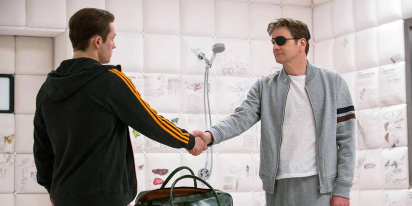 Eggsy and Harry Hart shaking hands in Kingsman: The Golden Circle