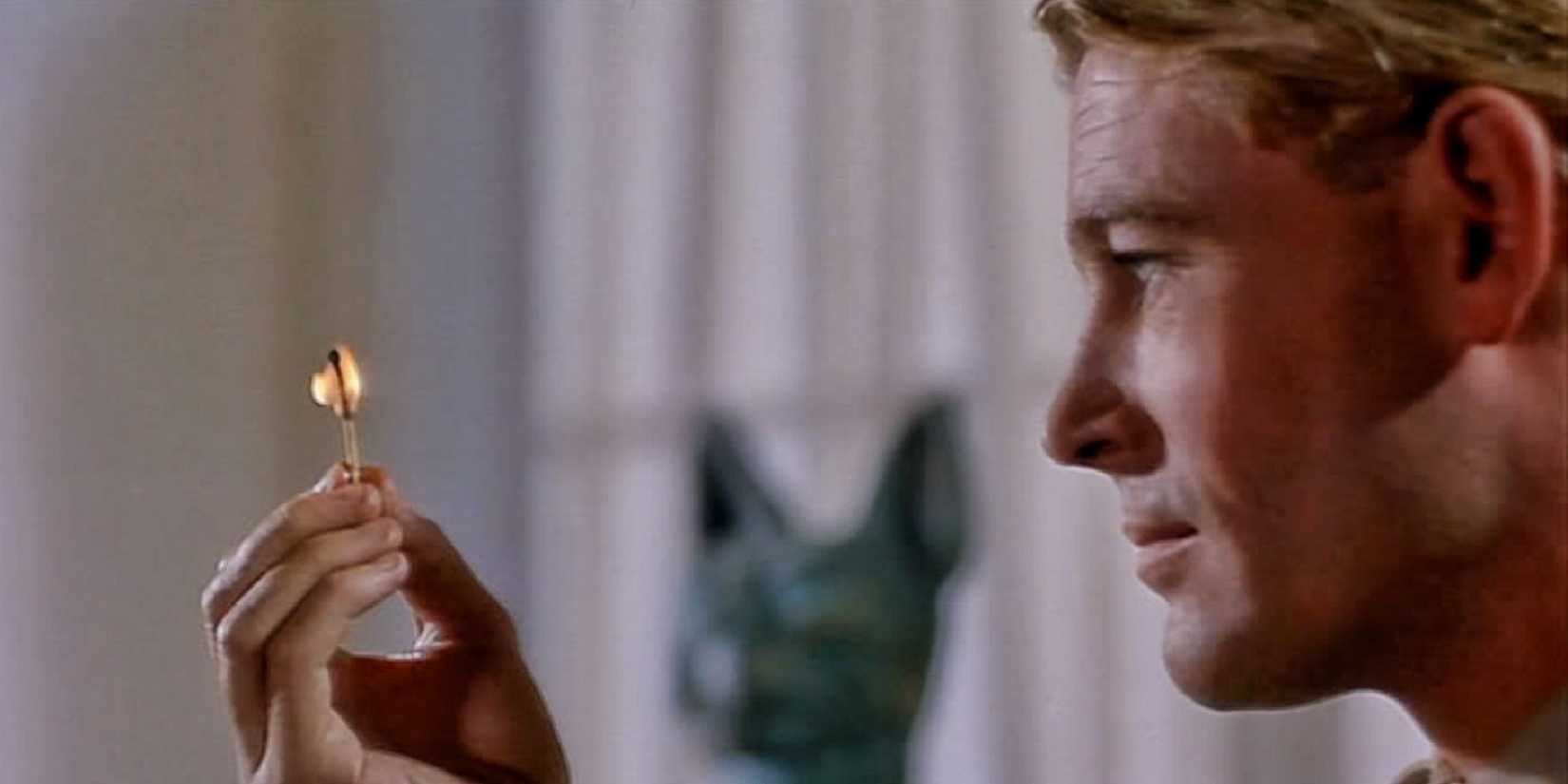 T.S. Lawrence (Peter O'Toole) looking at a gold trinket in Lawrence of Arabia