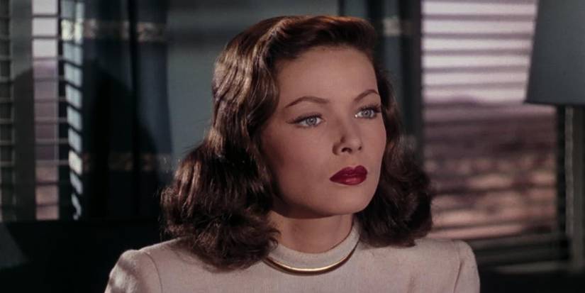 A close up of Ellen, played by Gene Tierney, staring ahead intensely, in Leave Her to Heaven
