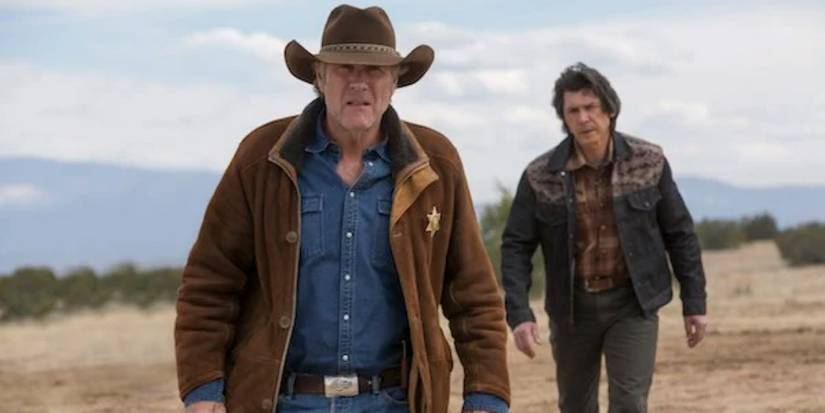 Walt Longmire (Robert Taylor) and Henry Standing Bear (Lou Diamond Phillips) walking in Longmire.