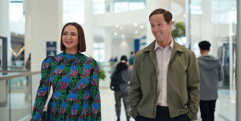 Maya Rudolph and Nat Faxon grinning as Molly and Arthur in Loot Season 2.