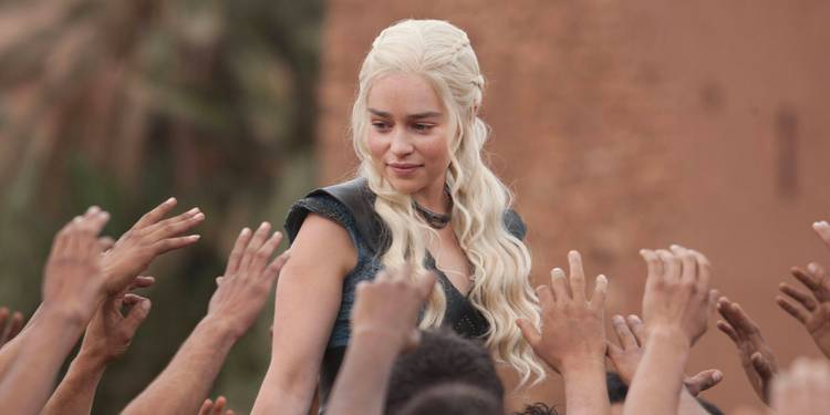 Daenerys Targaryen (Emilia Clarke) is revered as a savior by the freed slaves of Yunkai in Game of Thrones.