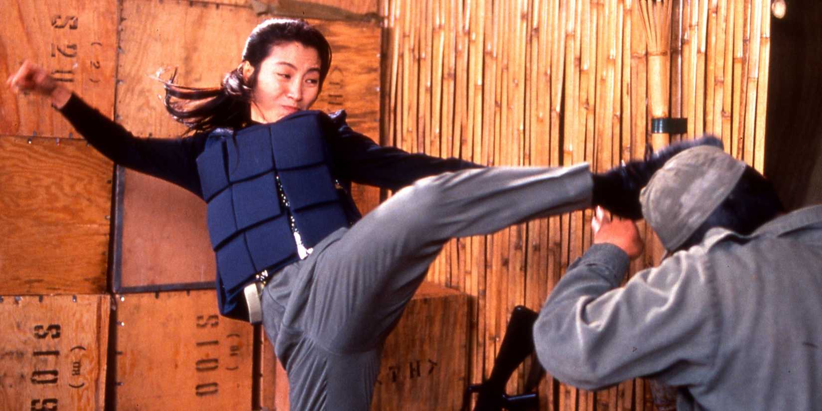 Michelle Yeoh kicking an assailant in Police Story 3: Supercop.