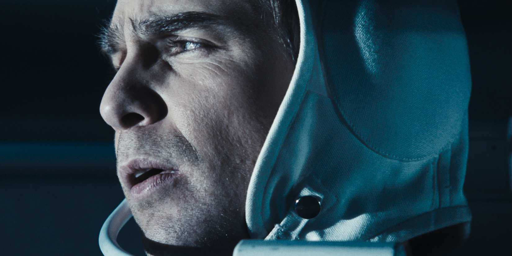 A profile close up of Sam Rockwell as Sam Bell looking to the left in Moon