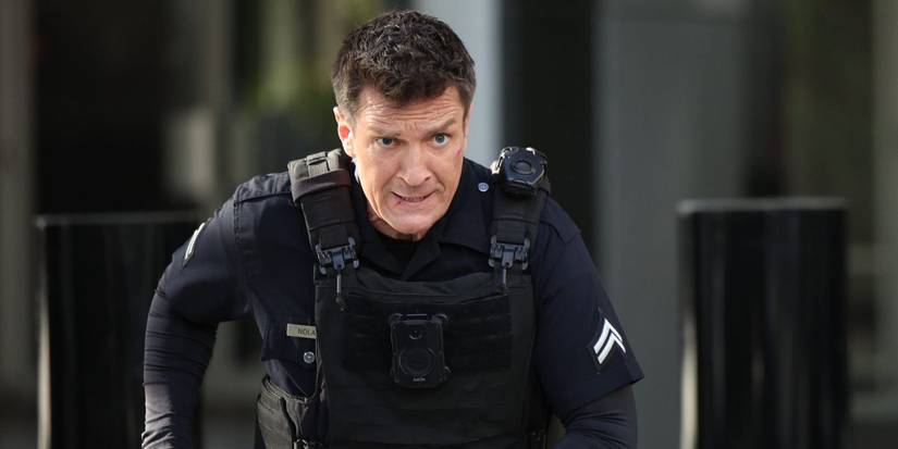 Nathan Fillion as John Nolan, running while wearing a bulletproof vest in The Rookie.