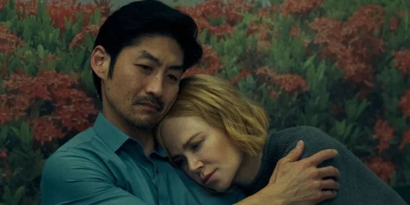 Brian Tee hugging Nicole Kidman as they sit down in 'Expats'