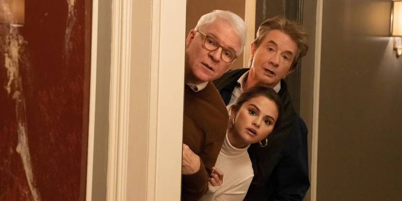 Charles, Oliver, and Mabel peek through a door on 'Only Murders in the Building.'