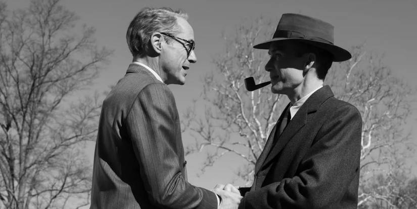 Lewis Strauss shaking hands with Robert Oppenheimer outside in Oppenheimer