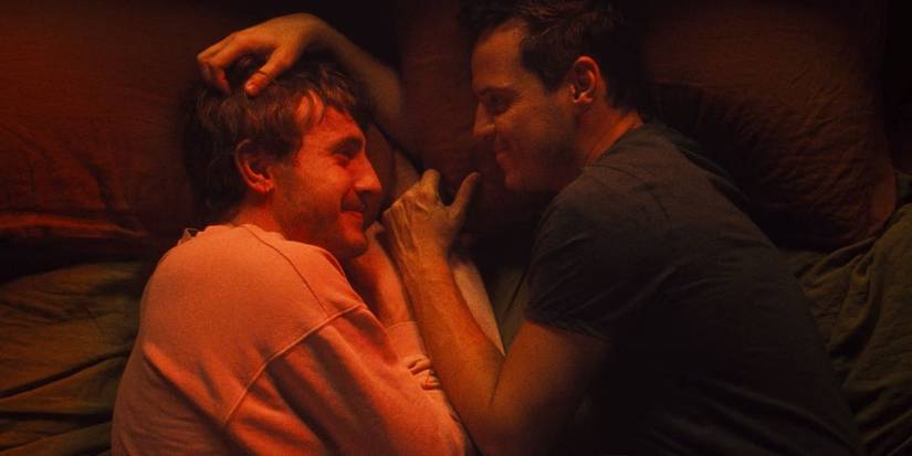 Adam and Harry lying in bed together in All of Us Strangers 