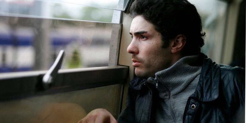 A close-up of Tahar Rahim looking out a window in A Prophet