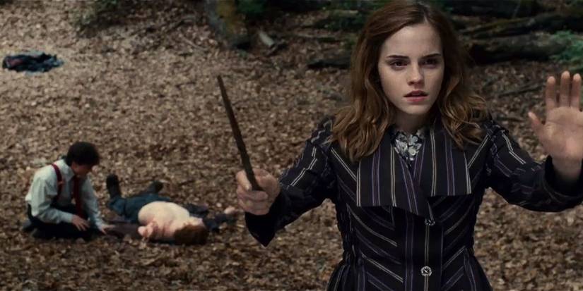 Harry tends to Ron while Hermione casts a spell