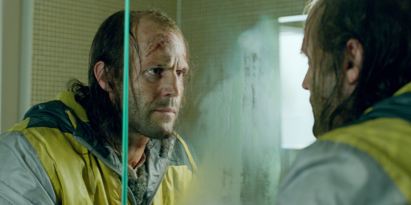 Jason Statham looking in the mirror in Redemption