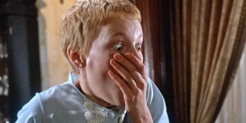Mia Farrow as Rosemary covering her mouth in shock and fear in Rosemary's Baby