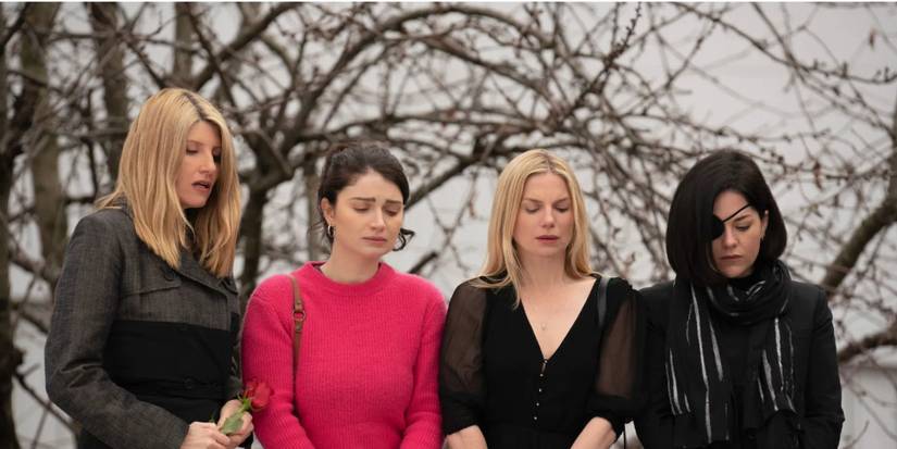 Sharon Horgan, Eve Hewson, Eva Birthistle, Sarah Greene, as Eva, Becka, Ursula, and Bib Garvey standing over grave in 'Bad Sisters'