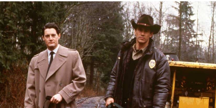 Kyle MacLachlan and Michael Ontkean as Dale Cooper and Sheriff Truman on train tracks in 'Twin Peaks'.