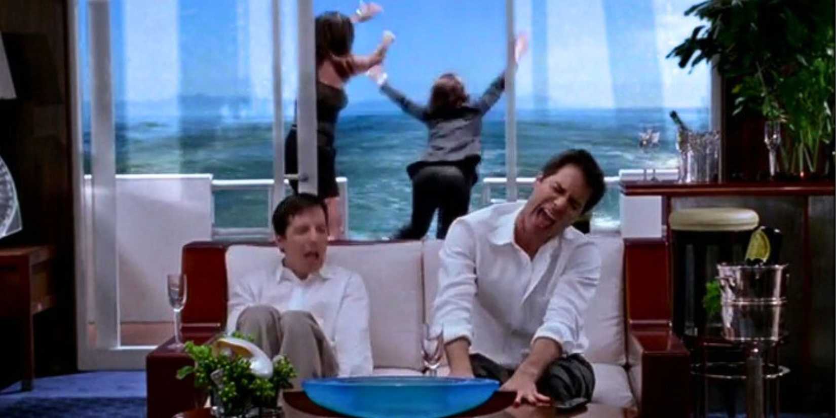 Sean Hayes and Eric McCormack singing on a boat while Minnie Driver pushes Megan Mullally overboard in Will & Grace