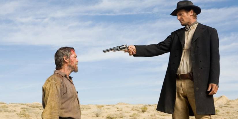 Morsman Carver (Liam Neeson) points his gun at Gideon (Pierce Brosnan) in 'Seraphim Falls'