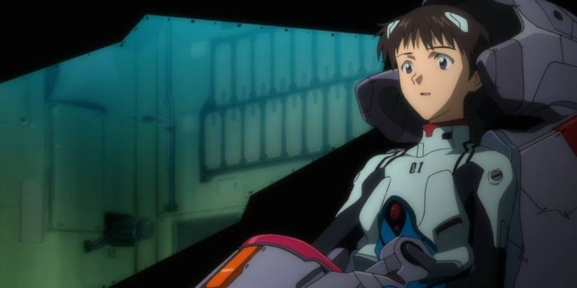 Shinji Ikari sitting in an Evangelion cockpit in Evangelion 1.0