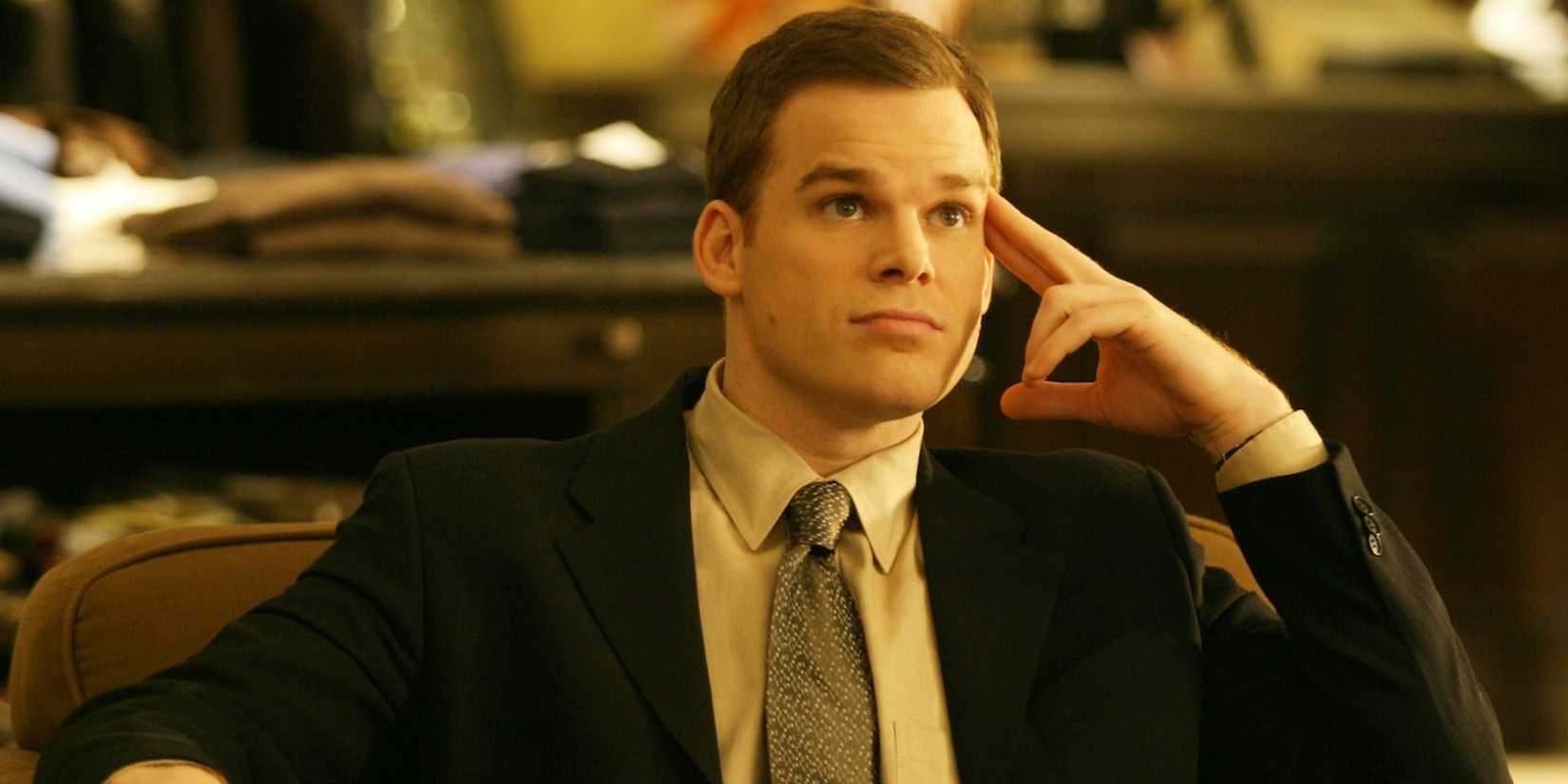 David Fisher sitting and looking up at someone in Six Feet Under.