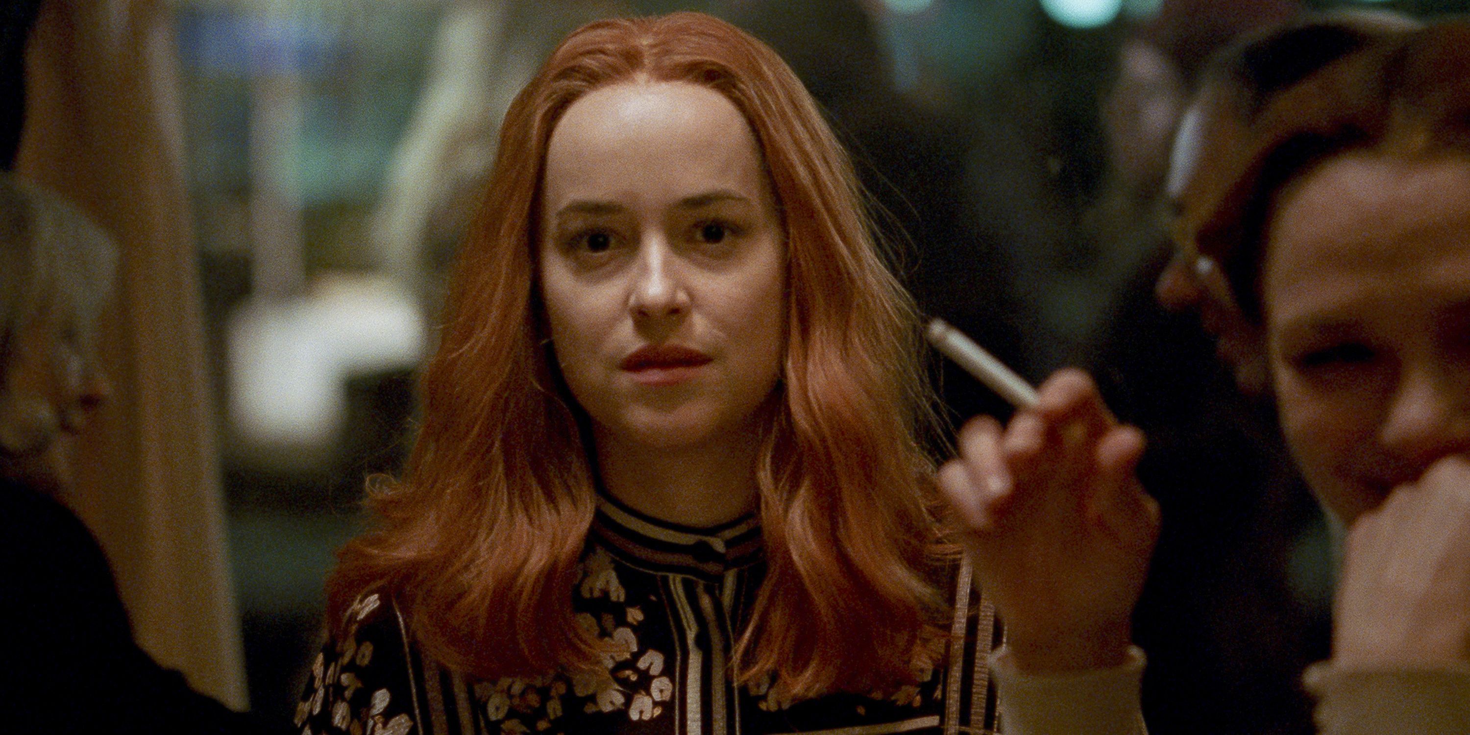 Suzy Bannion at a bar looking intently ahead in Suspiria