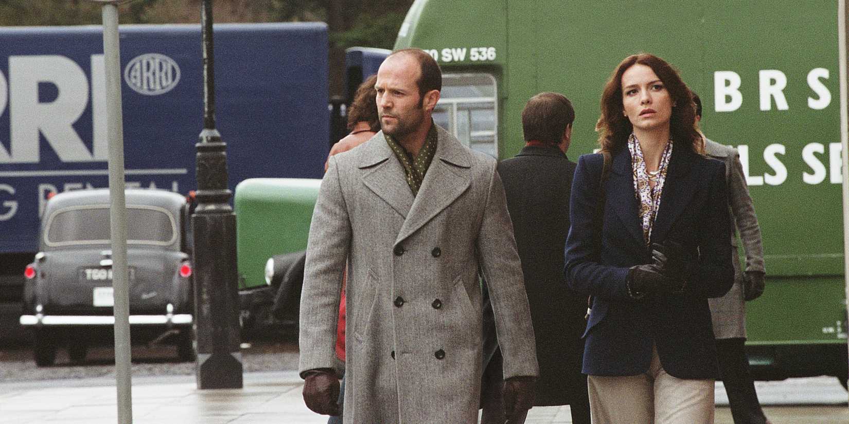 Jason Statham walks with Saffron Burrows down a city street in The Bank Job.