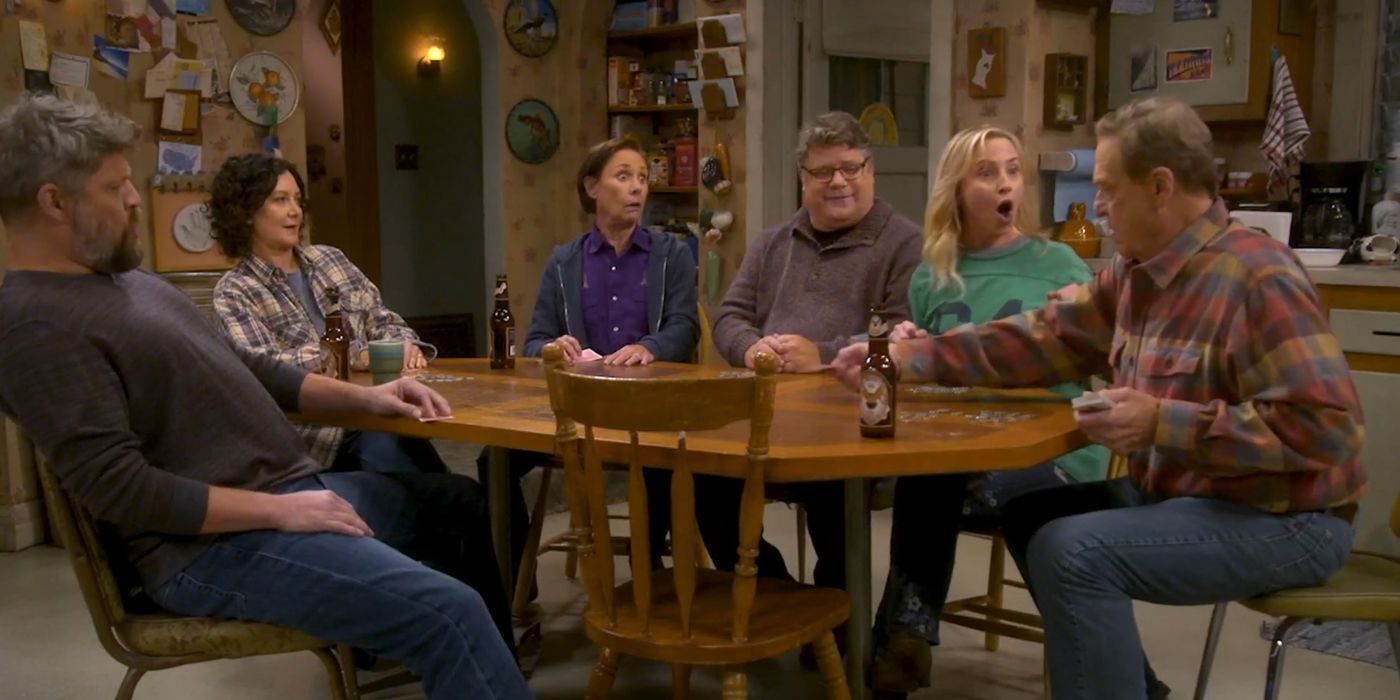 Jay R. Ferguson as Ben, Sara Gilbert as Darlene, Laurie Metcalf as Jackie, Sean Astin as Tyler, Lecy Goranson as Becky, and John Goodman as Dan, playing poker at the kitchen table in The Conners Season 6.