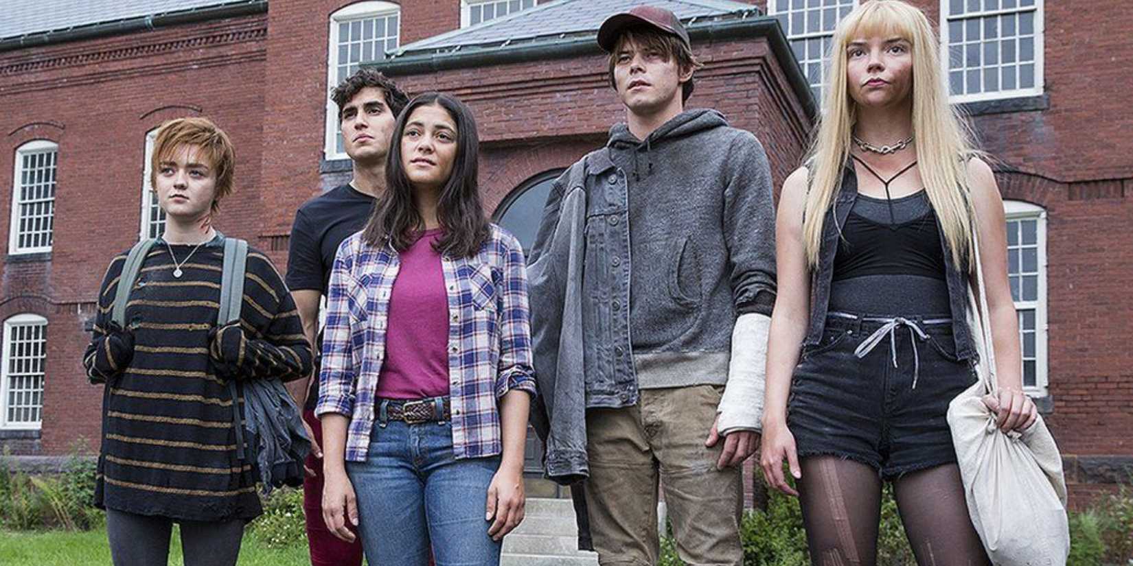 The cast of The New Mutants standing together outside their school.