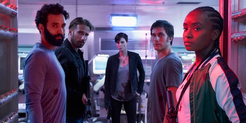 Charliez Theron and the cast of The Old Guard