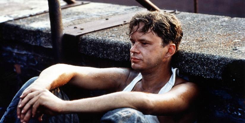 Andy sitting and looking ahead in The Shawshank Redemption 