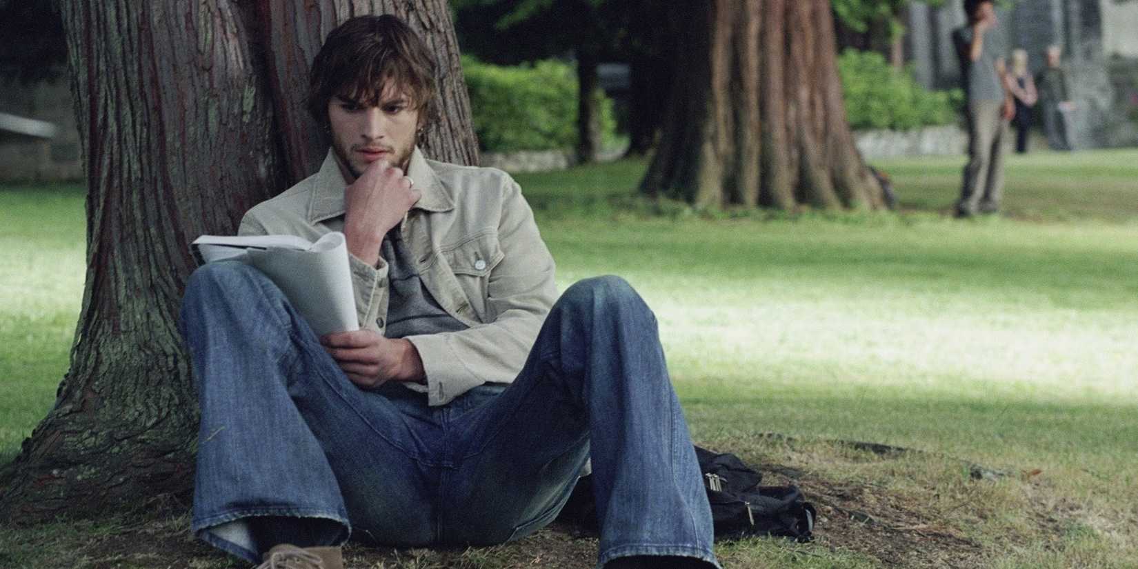 Ashton Kutcher reading under a tree in The Butterfly Effect