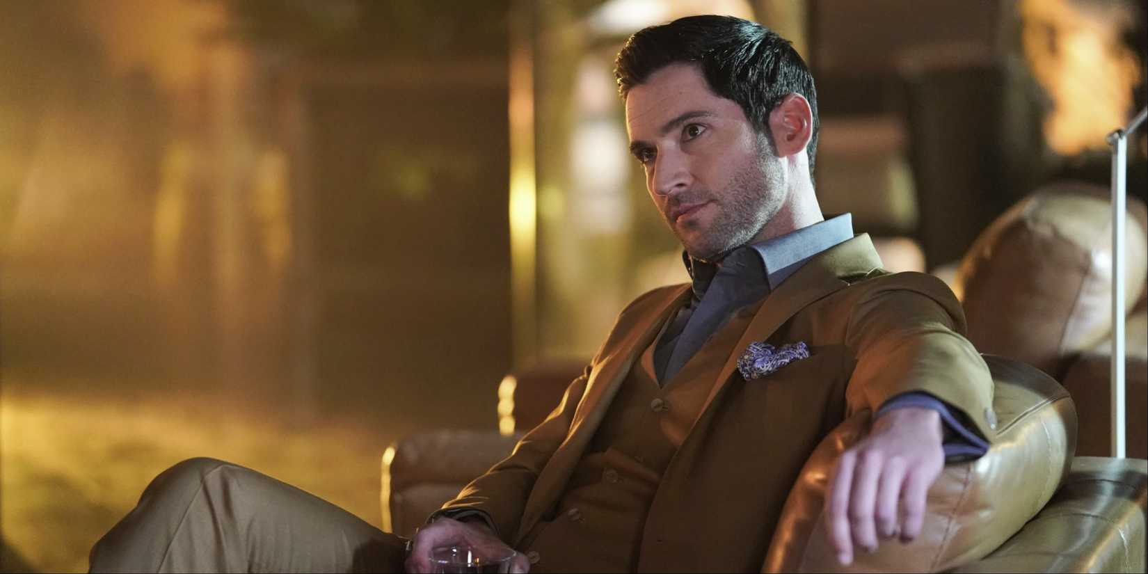 Tom Ellis as Lucifer drinking a cocktail in Lucifer
