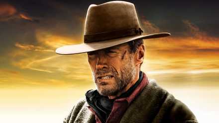 A close-up of Clint Eastwood wearing a cowboy hat, looking disgruntled in the 1992 Unforgiven poster.