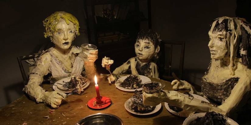 A family at the dinner table in The Wolf House - 2018