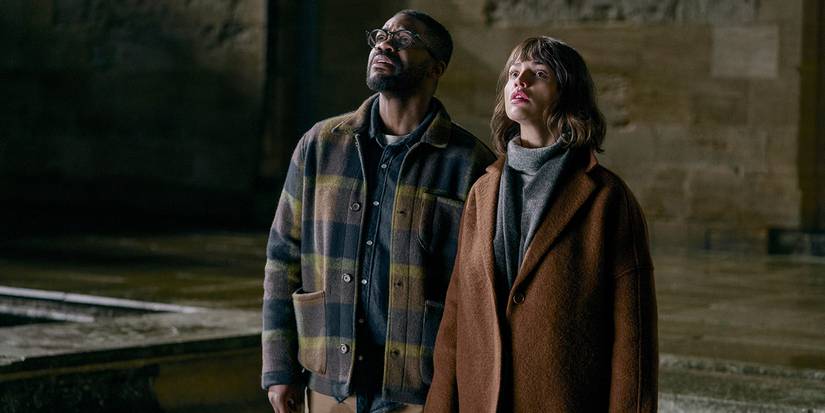 Jovan Adepo as Saul Durand, Eiza González as Auggie Salazar looking up in episode 101 of 3 Body Problem.