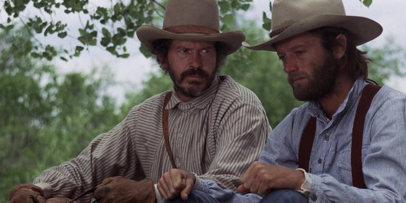 Warren Oates looking at Peter Fonda in The Hired Hand