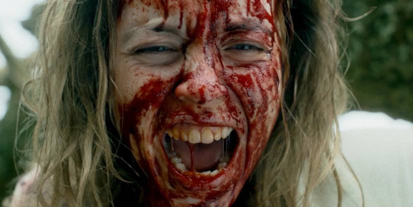 Cecilia, played by actor Sydney Sweeney, screaming with her face covered in blood in Immaculate. 