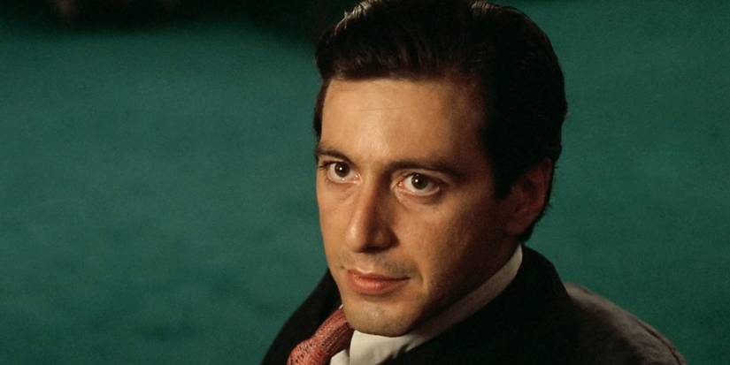 Al Pacino as Michael Corleone sitting in a chair, looking up in The Godfather Part II.