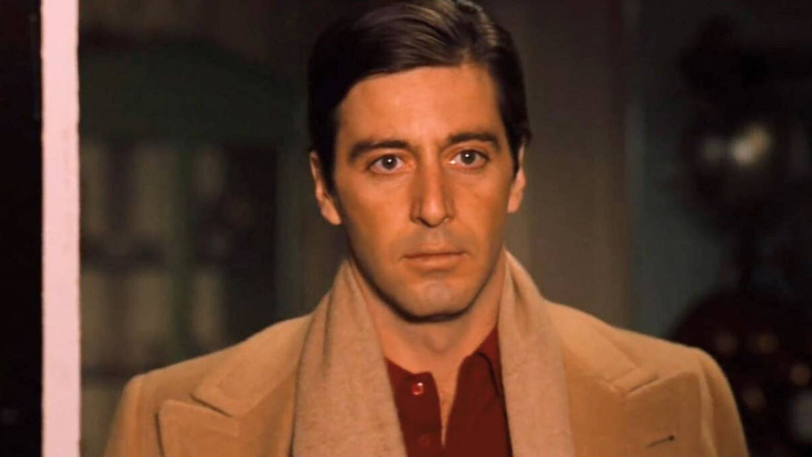 Al Pacino as Michael Corleone looking out a window in The Godfather: Part II (1974).