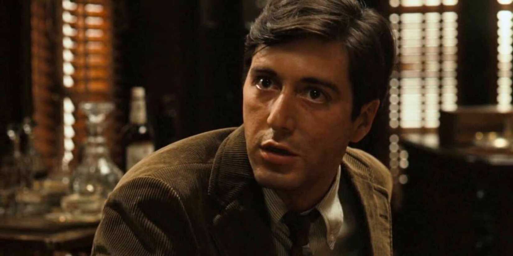 Al Pacino as Michael Corleone in an office, talking to someone off-camera in The Godfather (1972).