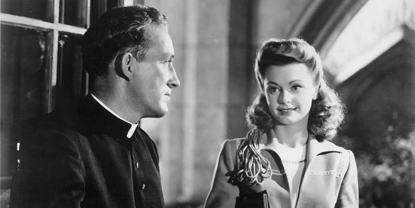 Bing Crosby as Father Chuck O'Malley in a conversation with Jean Heather as Carol James in Going My Way