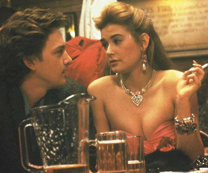 Andrew McCarthy and Demi Moore having a conversation in a bar in St. Elmo's Fire