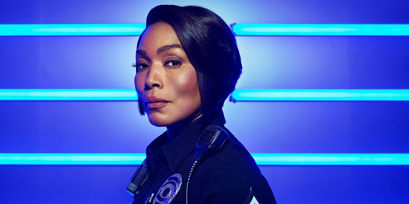 Angela Bassett as Athena Grant in uniform looking at the camera over the side of her left shoulder in 9-1-1