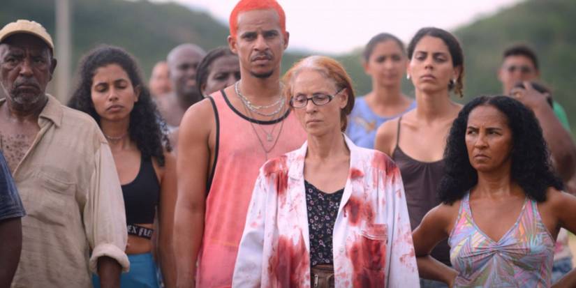 A group of survivors, some covered in blood