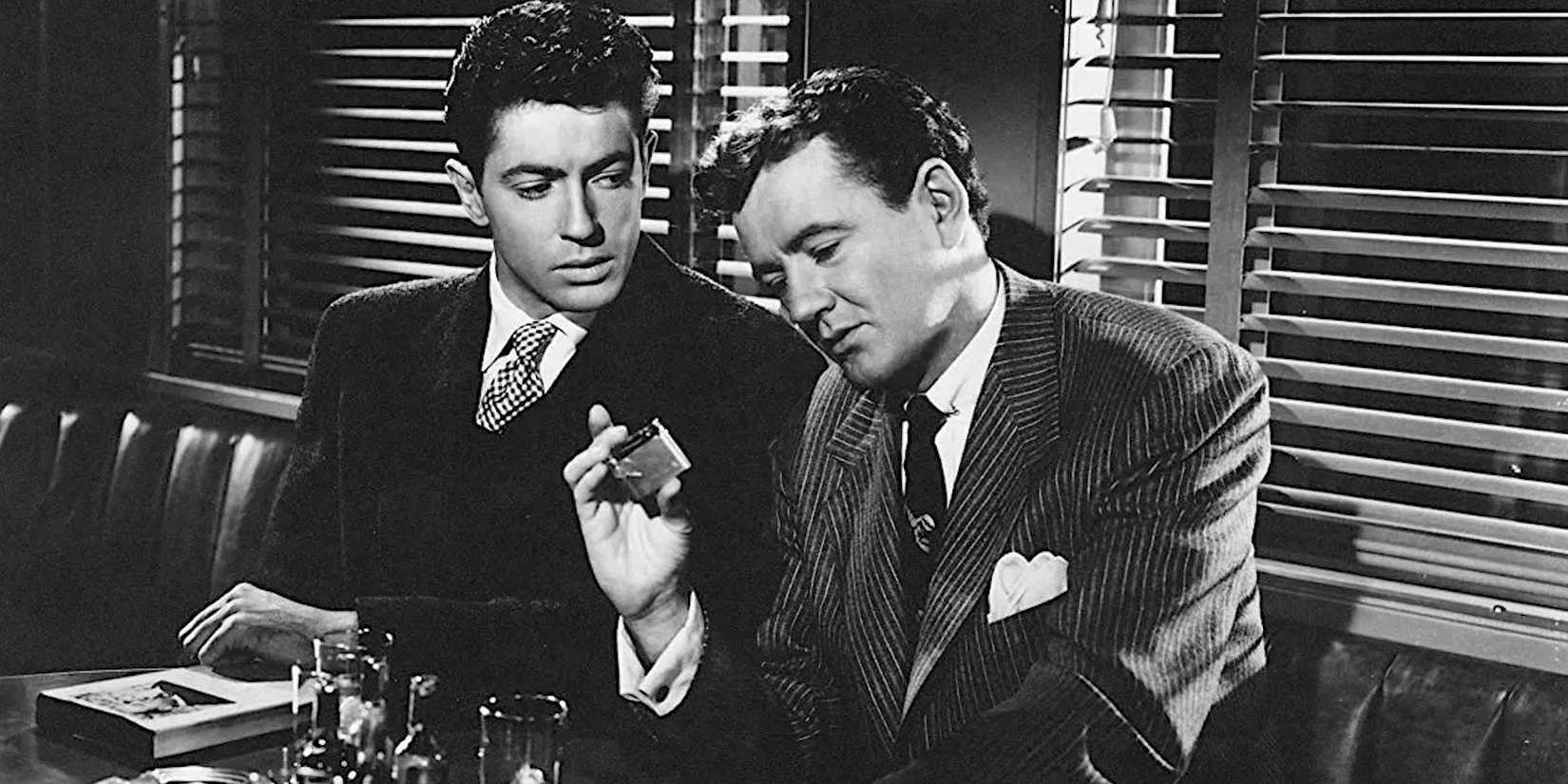 Guy Haines and Bruno Anthony talking in Strangers on a Train.