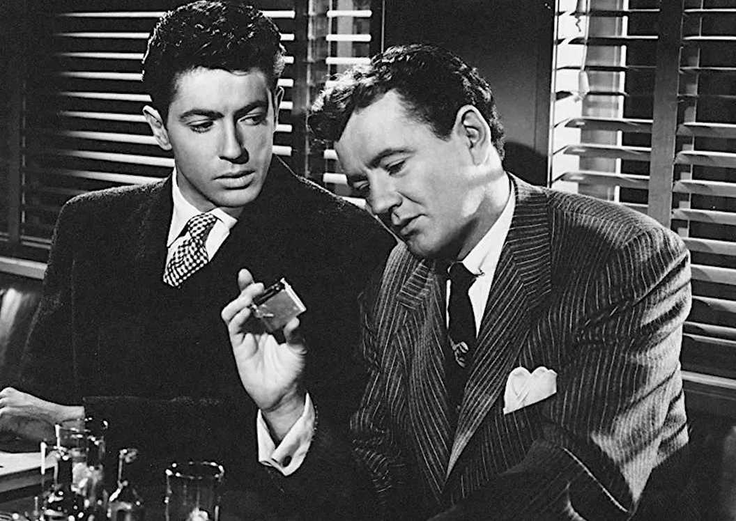 Guy Haines and Bruno Anthony talking in Strangers on a Train.
