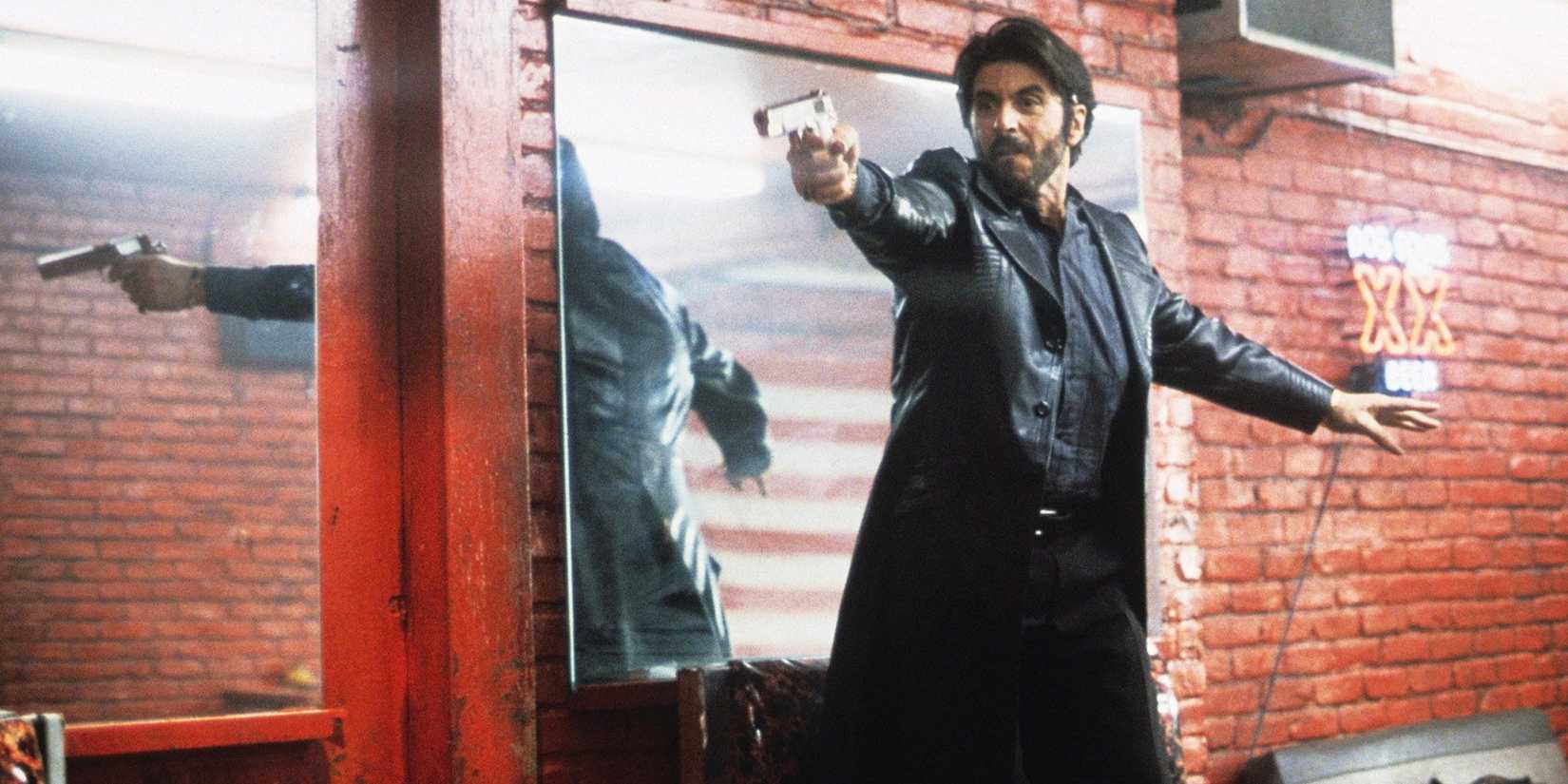 Al Pacino holding a gun and looking fierce in Carlito's Way.