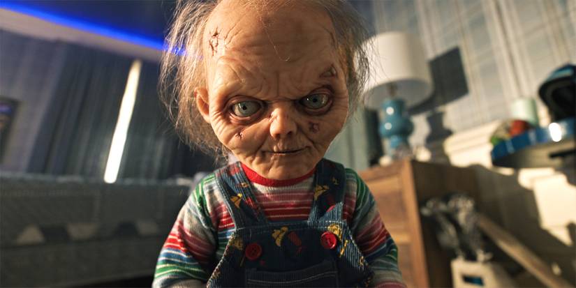 Chucky looking really old standing in a room looking into the camera in Season 3