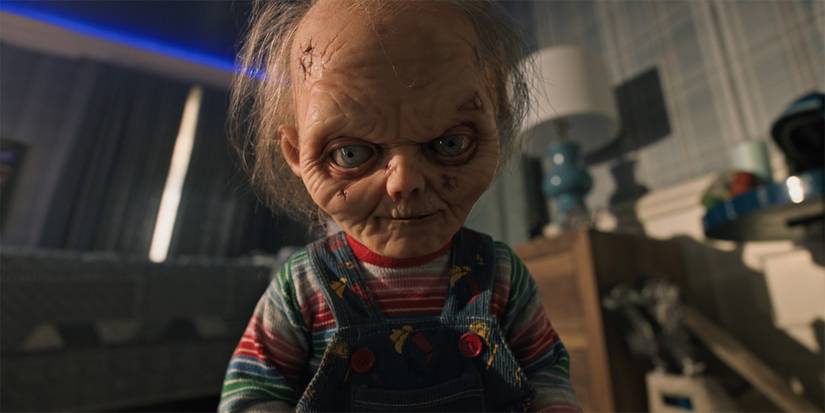 An elderly Chucky standing over a body in Chucky Season 3 Part 2