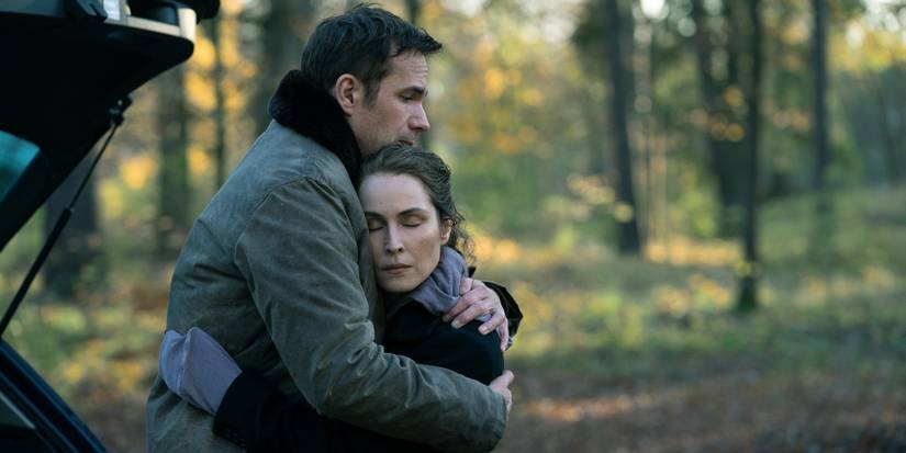 Noomi Rapace and James D'arcy embrace in the woods in the Constellation finale